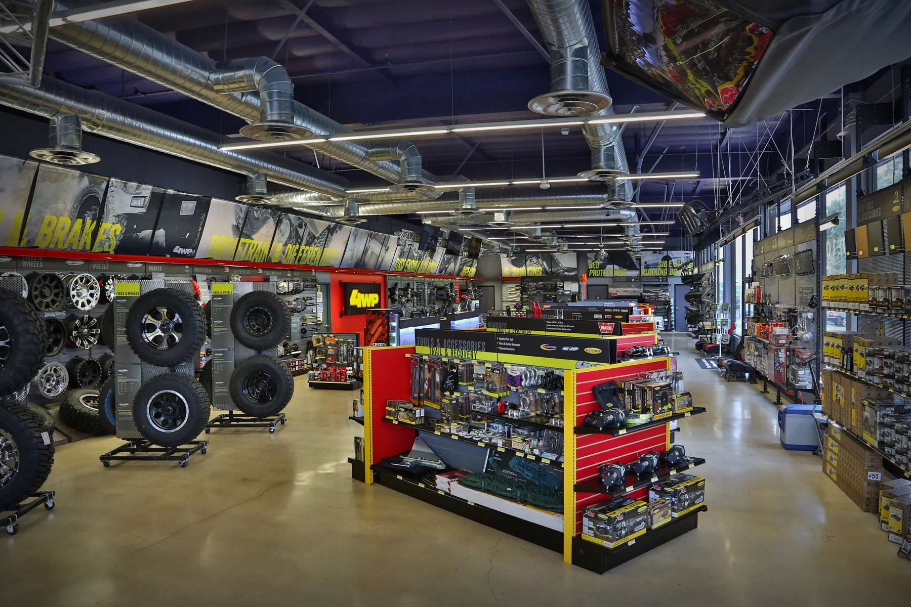 4 Wheel Parts retail store interior with off-road merchandising and wall graphics
