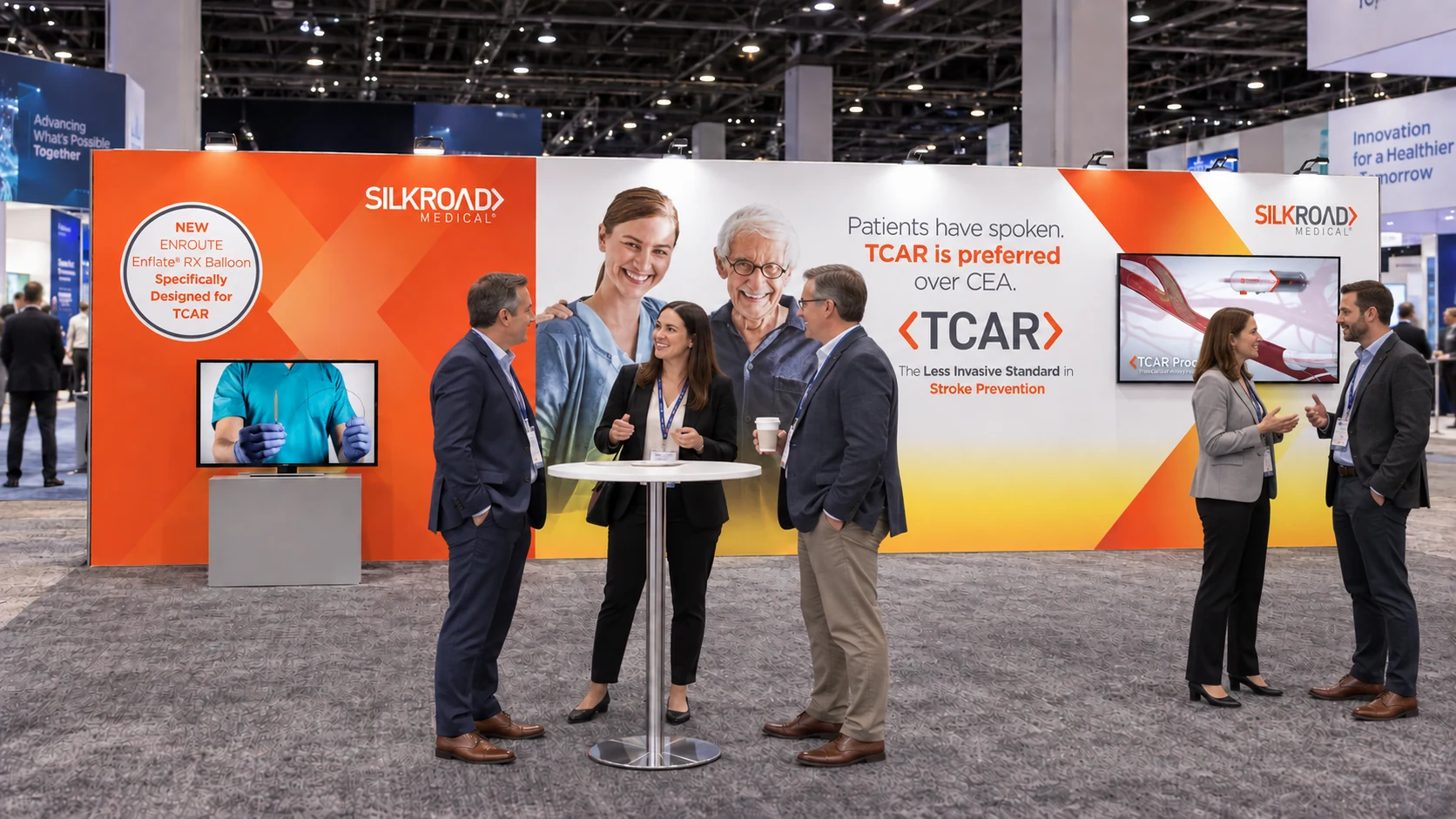 Silk Road Medical TCAR trade show booth featuring the Patients have spoken campaign wall, ENROUTE Enflate RX Balloon signage, and product demonstration monitors
